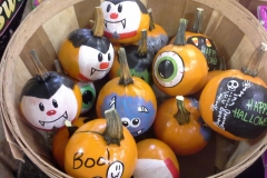 Painted pumpkins in a basket